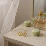 Rose quartz swirl heart earrings