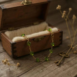 Seven stone peridot clover necklace